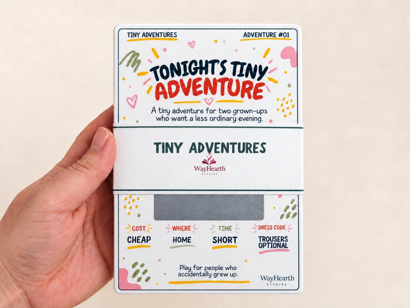 Tiny Adventures scratch-off pack held in one hand